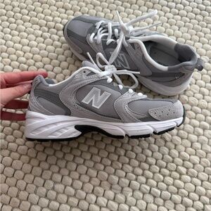 New Balance Light Gray and White Sneaker Pair